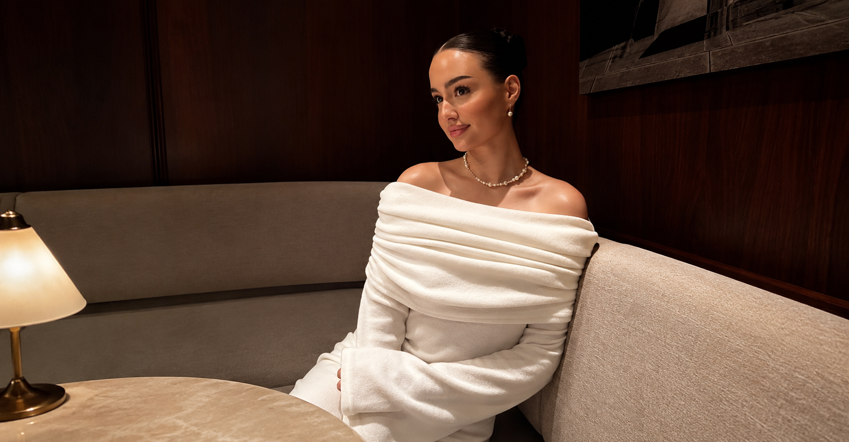 Woman in a tailored neutral outfit looking polished and confident